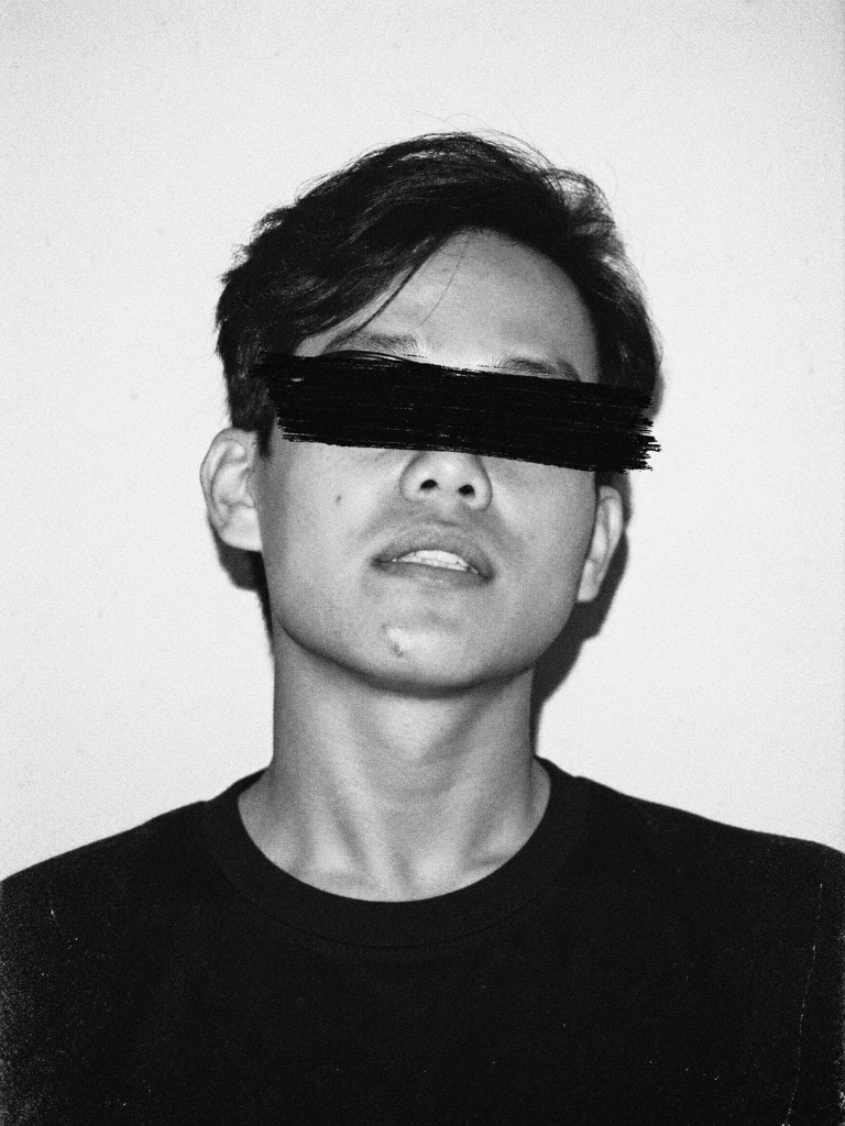 Black-and-white photo of Rezi with eyes redacted